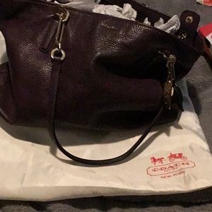 Coach women’s eggplant leather bag